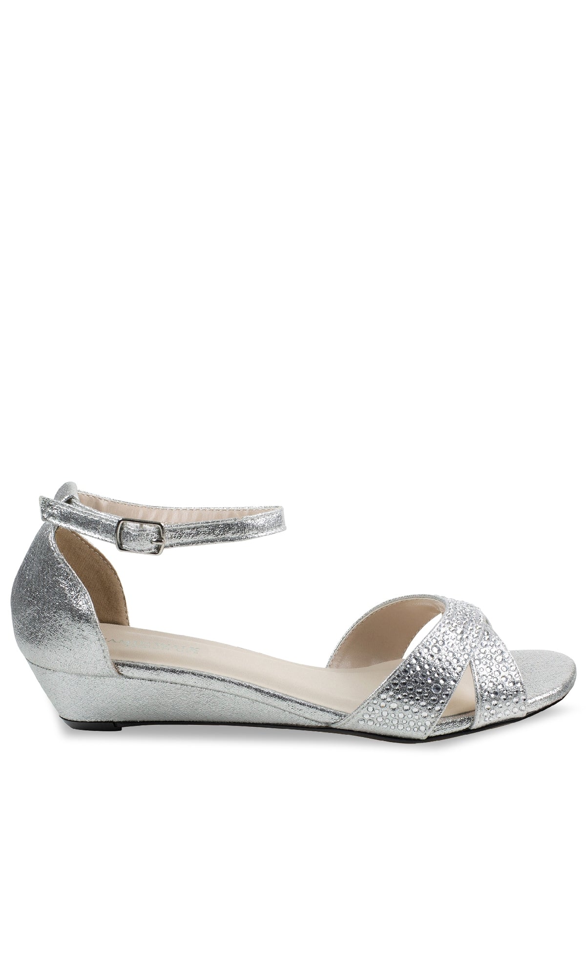 The Iris Silver Wedge Prom Shoes: Touch Ups 4626 feature a low wedge, textured surface, open toe, crisscross front straps, and an ankle strap with buckle—perfect for adding shine to your prom night look.